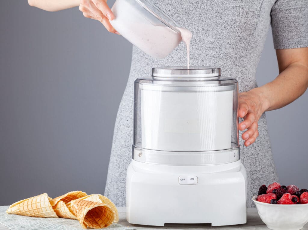 a Caucasian woman is pouring a homemade all natural ice cream