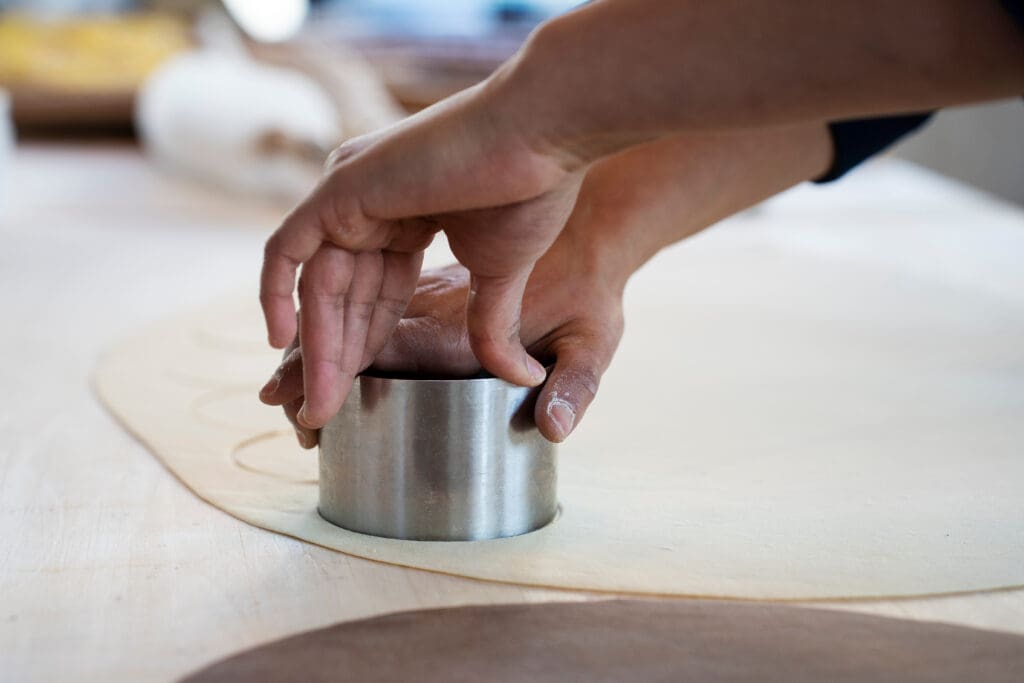 making a dumpling by pressing