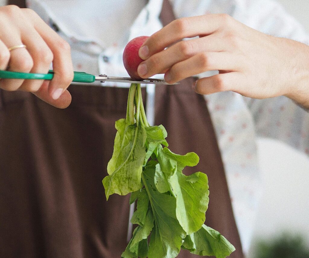 a chef used a scissor to cut a vegetable