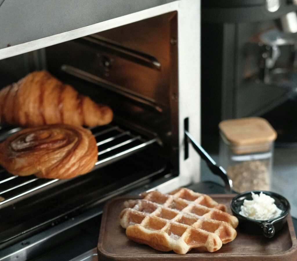 a toaster oven and a food to cook